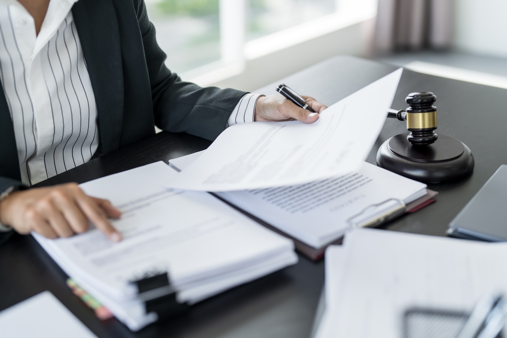 Background image of a gavel representing legal expertise in personal injury, family law, and estate planning in Baton Rouge.